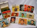 a 37 Vintage Elvis Presley 45 rpm Records & carry case 