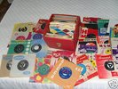 Orig. 50s & 60s singles in sleeves & record case Listed