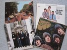 4 Beatles record albums for sale.
