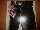 Rolling Stones Sticky fingers LP with card of the rolling stones and logo inside