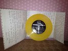 NIRVANA MELVINS SPLIT 7'' HERE SHE COMES CUSTARD YELLOW EFFECT VINYL