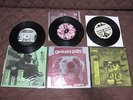 Green Day Slappy 1000 Hours Triple 7 inch Single in Stickered PVC Sleeve 7