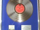 Barclay James Harvest BPI Silver disc presented to drummer Mel Pritchard 1977