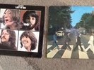 2x the beatles vinyl records  ablums are abbey road and let it be