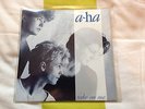 a-Ha - Take On Me / And You Tell Me  debut 7” in silver/blue sleeve