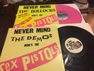Sex Pistols NEVER MIND THE B*LLOCKS PINK VINYL LP & DEMO LP & Postcard & Badge.