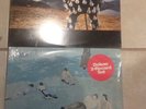 Two sealed vinyl records Pink Floyd live & Elton John blue movies.