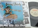 KLP62A - Sacred Reich - Surf Nicaragua (RR 9512 1) NL LP + OIS, roadracer 1988