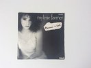 45t MYLÈNE FARMER.   MAMAN A TORT .  POCHETTE NOIR ET BLANC