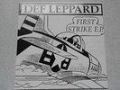 DEF LEPPARD-FIRST STRIKE E.P.  RED VINYL IN MINT CONDITION