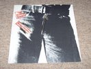 THE ROLLING STONES , STICKY FINGERS . LARGE ZIPPER . LISTEN TO BOTH SIDES .