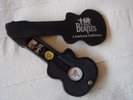 BEATLES Apple-approved wrist-watch in black wooden custom guitar case, unused