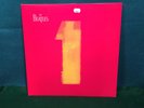 The Beatles. 1. LP Record UK Import Made in England 180 gm Vinyl NM/NM w/ Poster