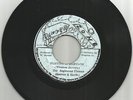 RIGHTEOUS FLAMES /  SLAVING IN BABYLON / BUS DEM SHUT VERSION / 7''/ VG+