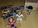 Three Micro brawlers Plus One Vinyl Figire, Bret Hart. Brutus Beefcake.