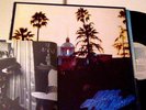 NM EX 1976 orig EAGLES HOTEL CALIFORNIA lp w POSTER inner 7E STERLING plays EX