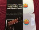 Ultravox: Slow Motion 12” Clear Vinyl & Quiet Men 12