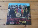 The Beatles SGT. Peppers Lonely Hearts Club Band vinyl LP with cutouts