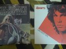 Janis Joplin's and The Doors Greatest Hits LPs