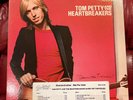 Tom Petty Damned the Torpedoes Promotional copy with strip.  Very nice condition