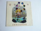 QUEEN INNUENDO VINYL LP PROMO COPY HAS PROMO STICKER AND PROMO PHOTOGRAPH