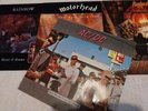 four heavy rock vynl records, rinbow, ac/dc, magnum, motorhead