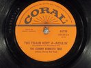 78 RPM  Johnny Burnett Trio, Coral 61719 Train Kept A-Rolin', V+/EE-  Rockabilly
