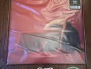 BAD OMENS THE DEATH OF PEACE OF MIND ORANGE SPLATTER VINYL IN HAND