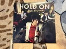JONAS BROTHERS HOLD ON 7
