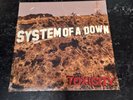 Toxicity by System of a Down sealed few tears in cellophane but not opened