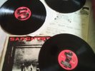 The clash Sandinista LP. Vinyl is perfect. Cover shows wear.