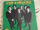 THE TURTLES GREATEST HITS BOX SET 8 GREEN VINYL 45RPM COLLECTABLES