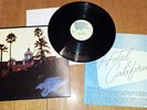 The EAGLES Hotel California 1976 Vinyl LP Asylum Records 7E-1084 w/Poster N Mint