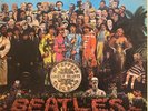 Sgt. Pepper’s Lonely Hearts Club Band by The Beatles, original release vinyl LP.